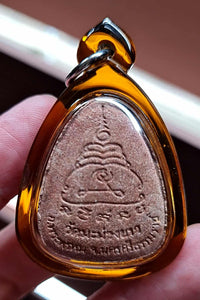 Thai amulet Phra Pidta Pangpakan Maha Lap – Red Wan Powder, Wat Ma Muang Khao, Nakhon Si Thammarat (BE 2553 / 2010)