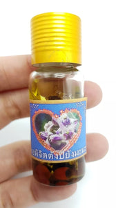 Thai amulets love charming oil "Millions love" edition by Luangta Ruam , Wat Koksumrarn.